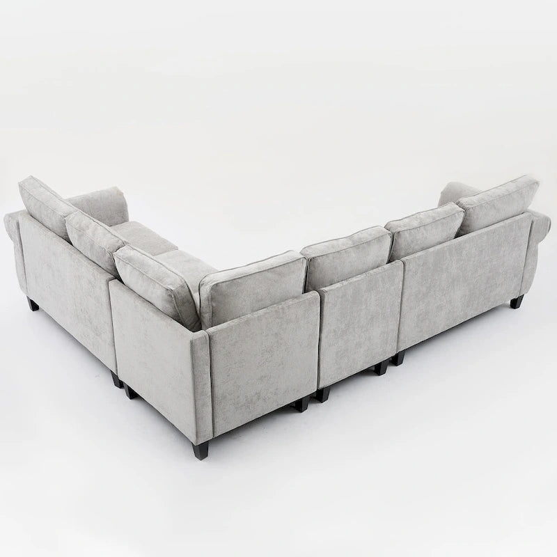 Canapé d'angle 6 places en chenille avec accoudoirs roulés décorés de rivets